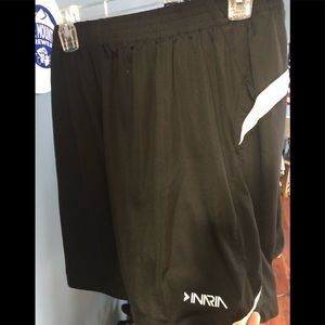 Black and white elastic styled athletic shorts.